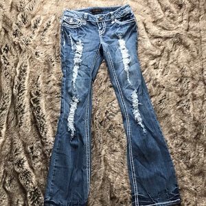 Distressed boot cut jeans
